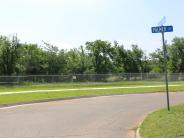 Trail next to street sign.